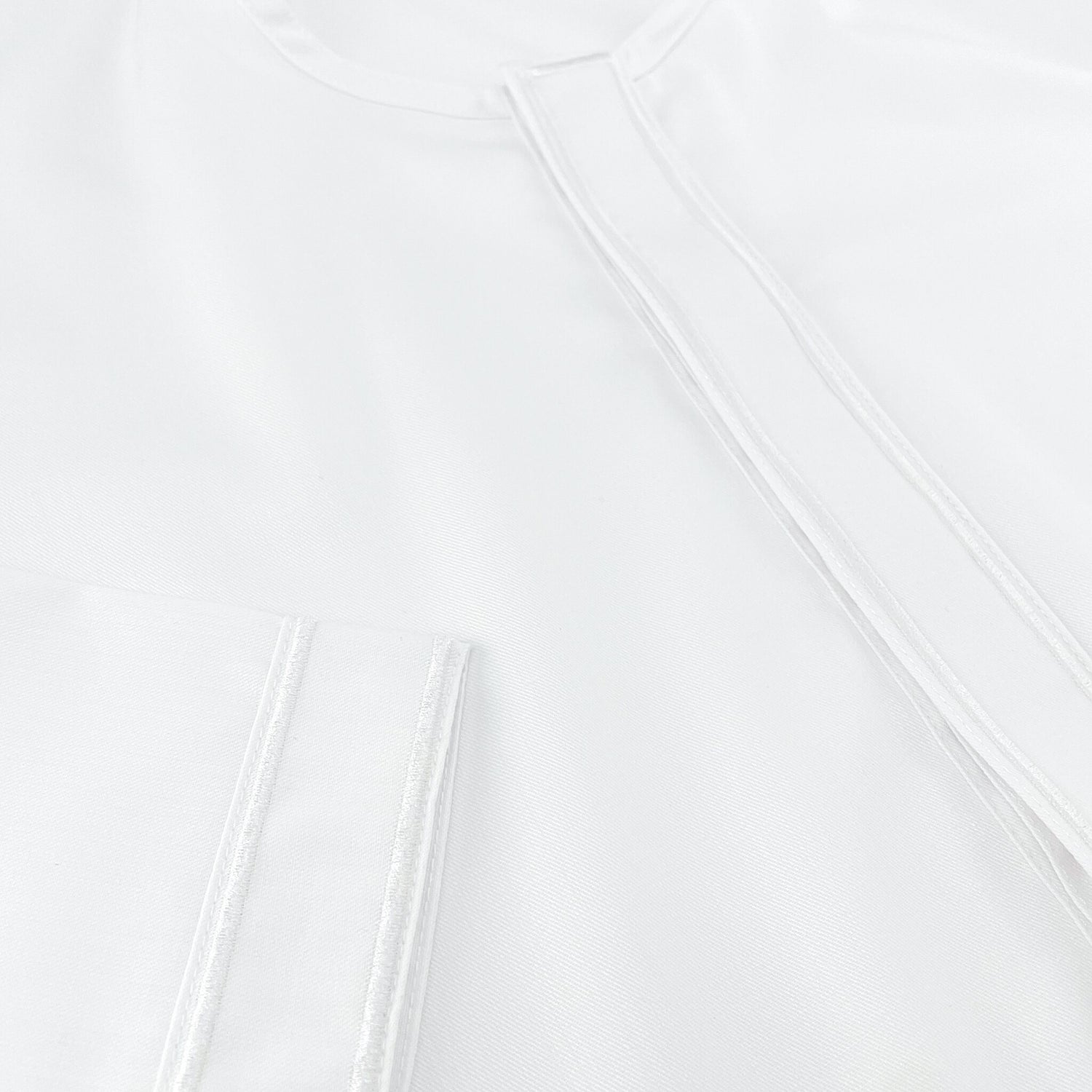 Detialed view of Jubah Ihsan's embroidery at cuffs and placket | Toobaa Singapore 