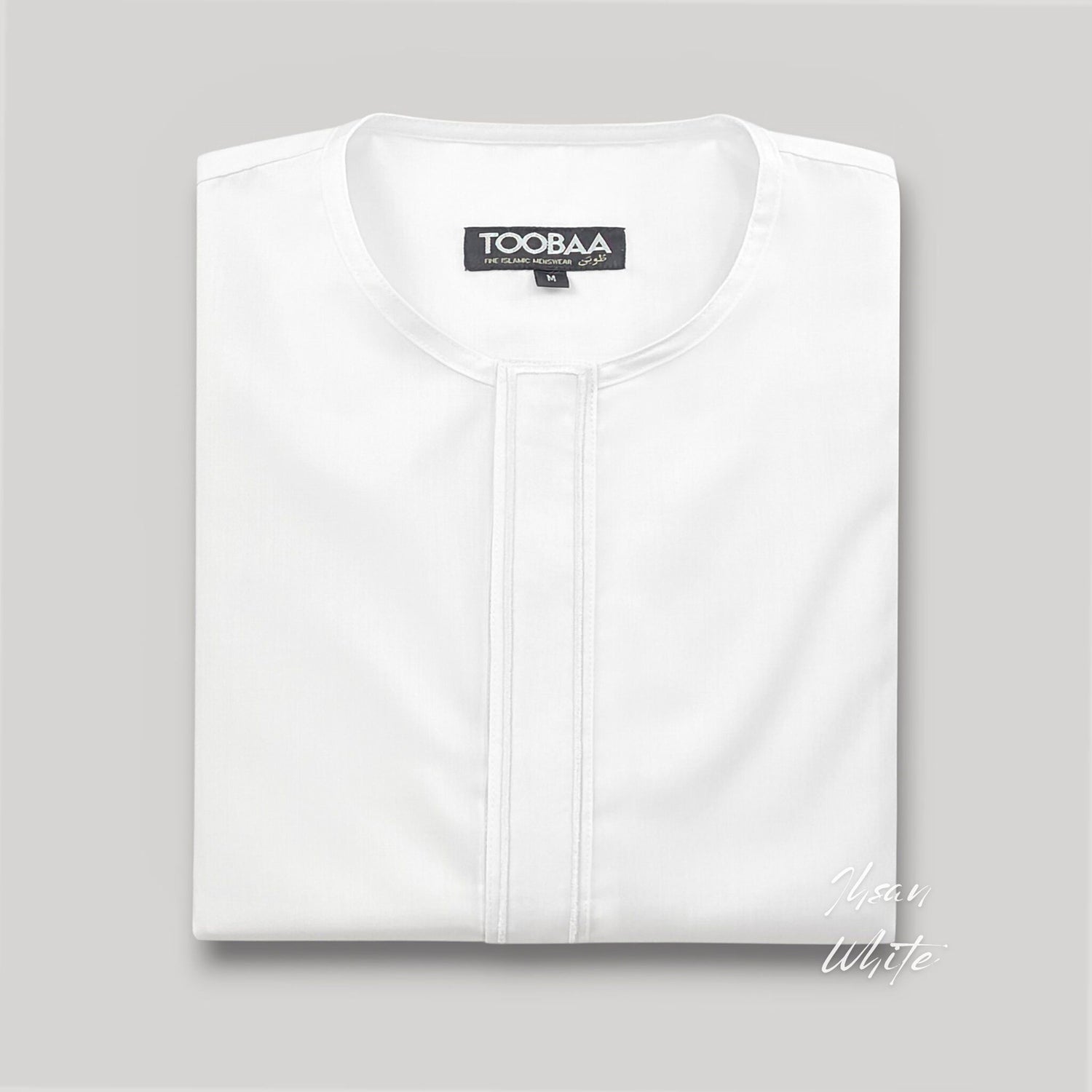 Premium Ihsan White thobe by Toobaa neatly folded showing fabric texture and immaculate stitching and embroidery.
